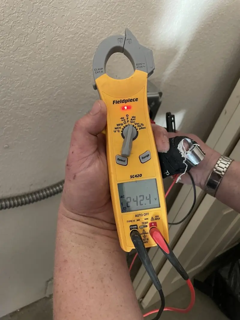 Voltage testing with clamp meter during Electrical Installation Services in Hermon